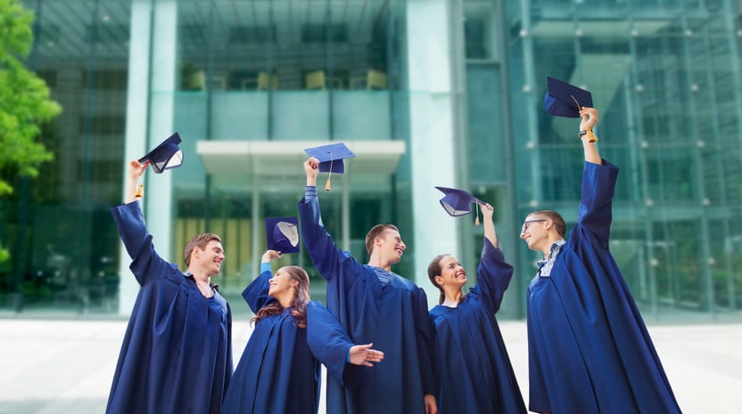 Group of Smiling Students with Mortarboards