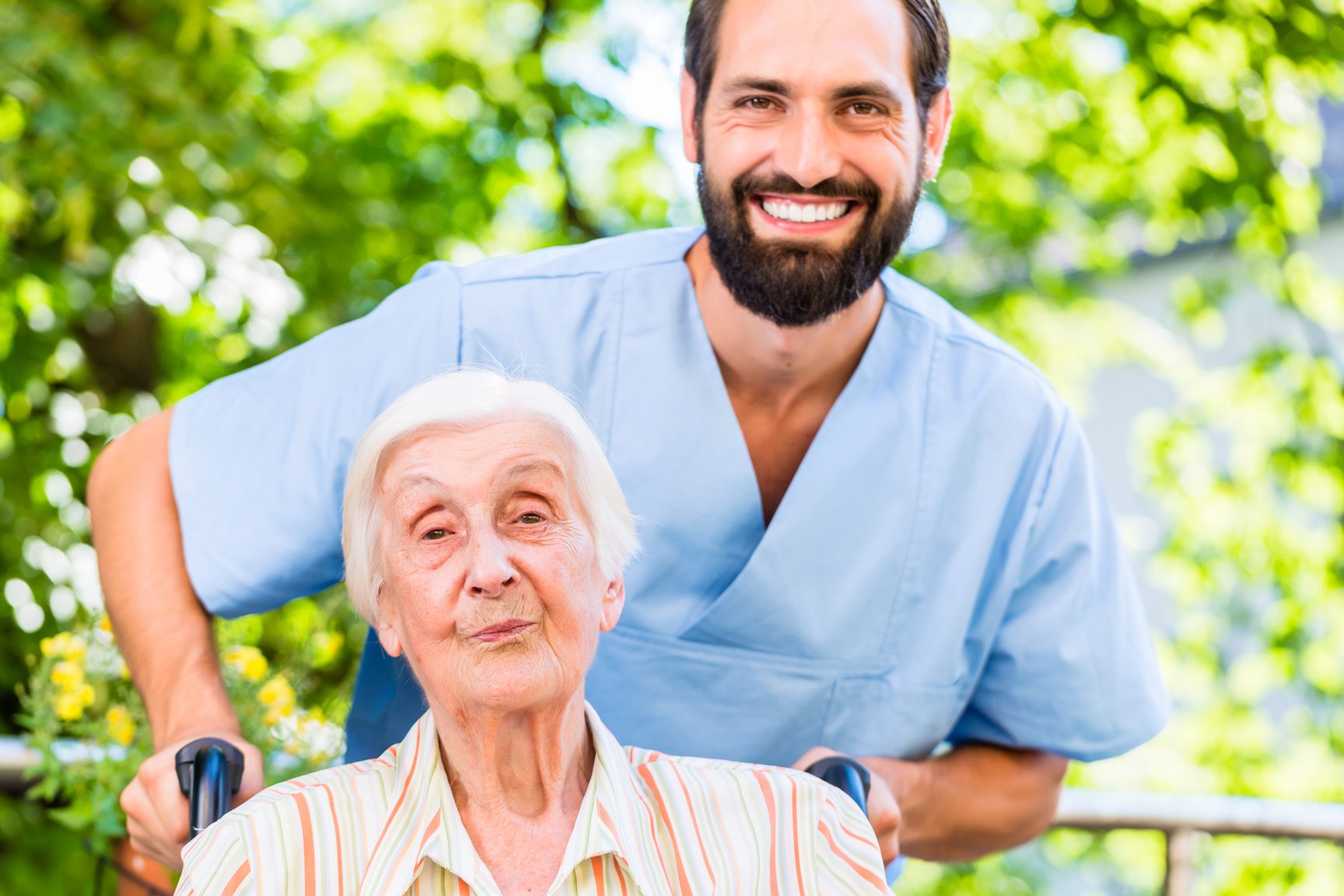 Geriatric Nurse Pushing Senior Lady 